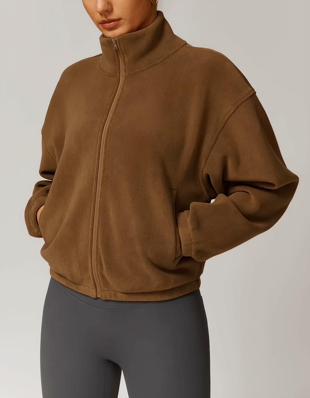 Woman wearing stylish women's anti-pilling fleece jacket, SF2344, ideal for outdoor activities like running and hiking.